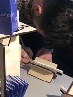 A picture of a visitor writing and drawing their lost story