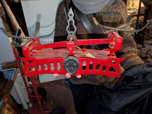 A photo of a antique red scale in Lea’s hands.