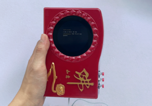 Holding chanting machine.png