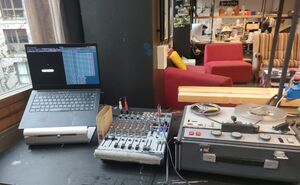 Image depicting a laptop connected to a mixer which is connected to a Sony Tapecorder